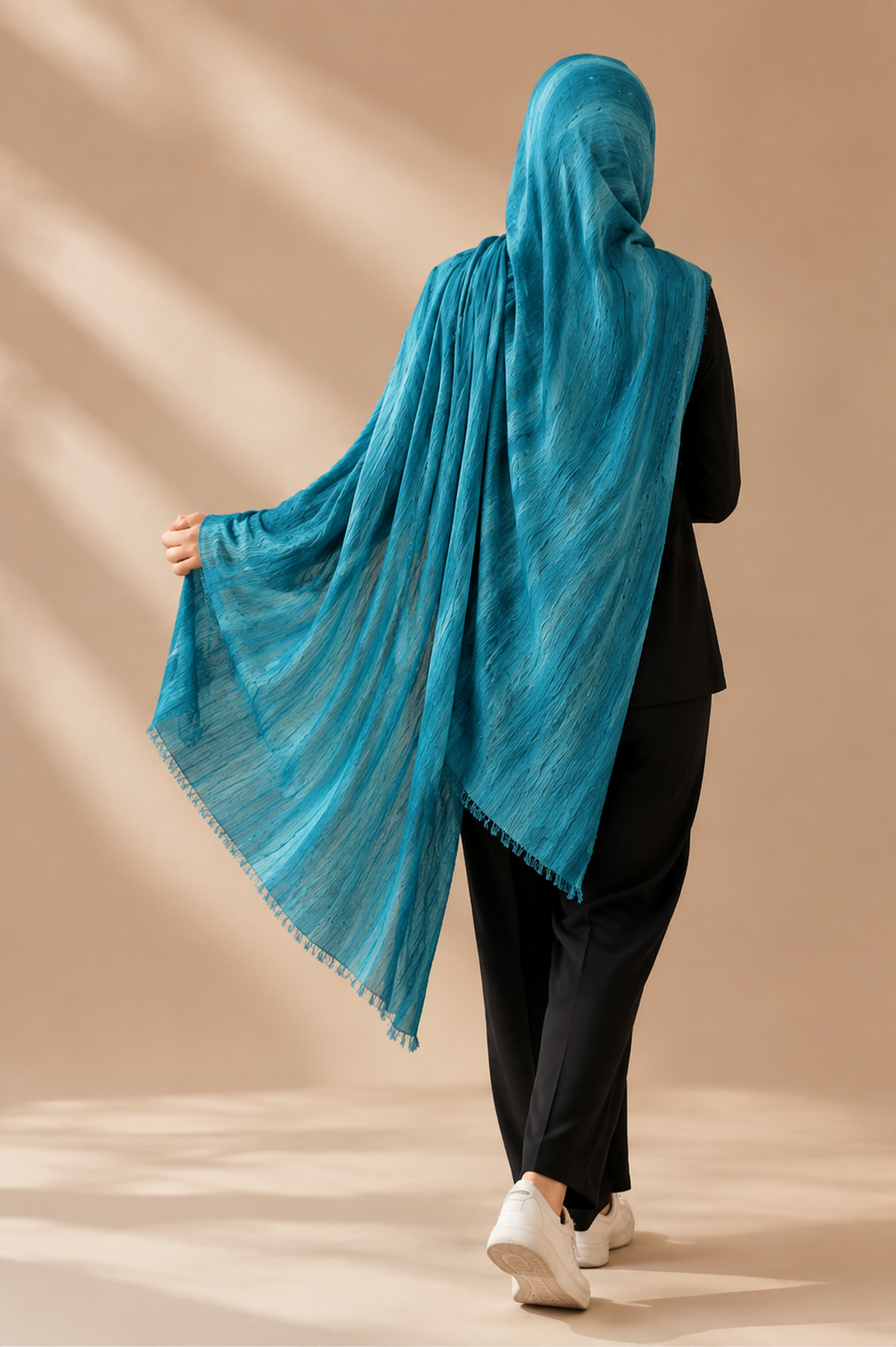 Crinkle Modal veil shown from the back in lagoon blue